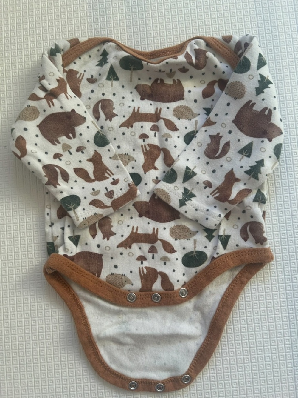 Baby bodysuit with woodland creatures pattern